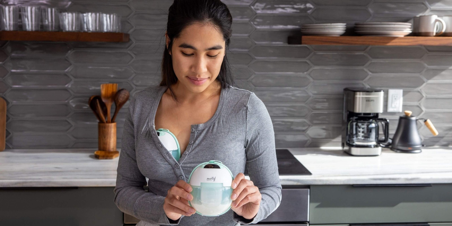 mom holding breast pump